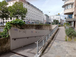 The platform shelters can be seen above this subway entrance