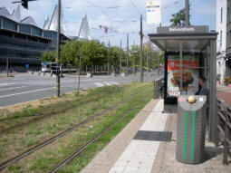 The northbound platform, with a tram coming from one of the southbound platforms in the background