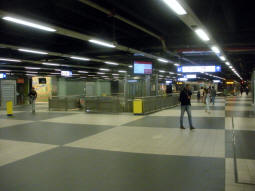 Escalators, stairs and lift down to the through tram platforms, and behind that the bay platforms for trams terminating from the north