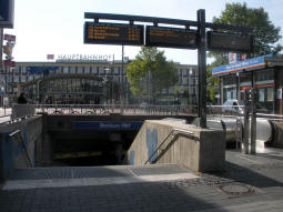 An entrance with the railway station in the background