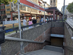 Access to a subway for crossing the tracks and the street to the right from the westbound platform. These days you can also cross both on the level