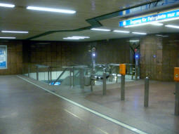 Escalators down to the platforms from the concourse
