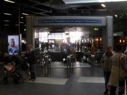 Escalators straight down to the island platform from the railway station concourse