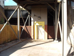 The lift to the street from the platform for trams to Manchester, which goes up into a much older building