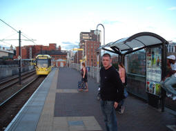 Looking along the platform for trams to Altrincham, St. Werburgh's Road and Eccles. A tram to St. Werburgh's Road is just coming in