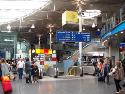 Escalators and stairs from mainline station concourse to an intermediate level with access to Metrolink