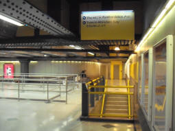 From the top of the escalator from the Arrivals platform, we have the stairs and lift down (the lift also goes up to the mainline station, see earlier photo of it there)