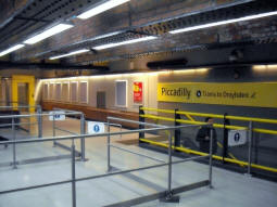 The ways down to trams to Droylsden from the mezzanine level. The lift also goes up the National Rail station