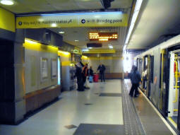 Looking along the platform for trams to Altrincham, Bury and Eccles with the new passenger information display in view