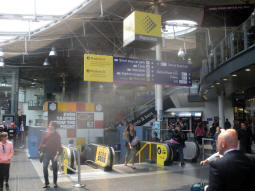 The escalators and stairs down to Metrolink and Fairfield Street from the railway station concourse
