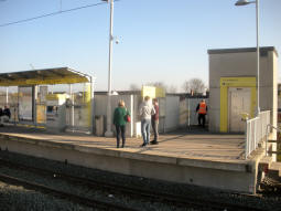 The exits from the platform for trams to Manchester seen from the other platform