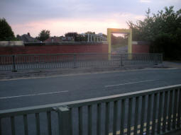 Looking across St. Werburgh's Road from the lift and stairs entrance to the ramp entrance