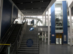 Escalator, stairs and lift up to the stop from the railway station concourse