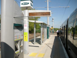 Looking along the platform with a third ticket machine in view
