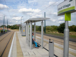 Looking along the side of the island platform for trams to the city centre (contrary to what the sign suggests)