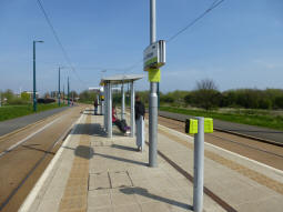 Looking along the platform from the side for trams to the city centre