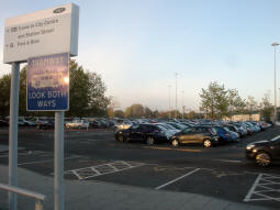 The car park and the tram depot beyond from by the platform for trams to the city centre (and "Station Street", a stop that closed years ago)