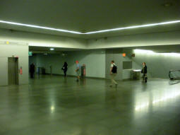 Lift (left) and stairs and escalators (right) to the northbound platform, and a passage to an exit (centre) on the ticket hall level