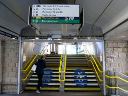 Looking towards the railway station exit for the Supertram stop from the footbridge. A lift just off to the left provides step-free access to this exit as well as to platforms 6, 7 and 8
