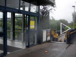 Auto-stitched panorama showing the entrance to the station footbridge, the stairs down to Metro platform 4 and the path to Halfords Lane