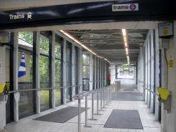Looking towards the footbridge from the railway station ticket office. The other end of the footbridge is over the Metro